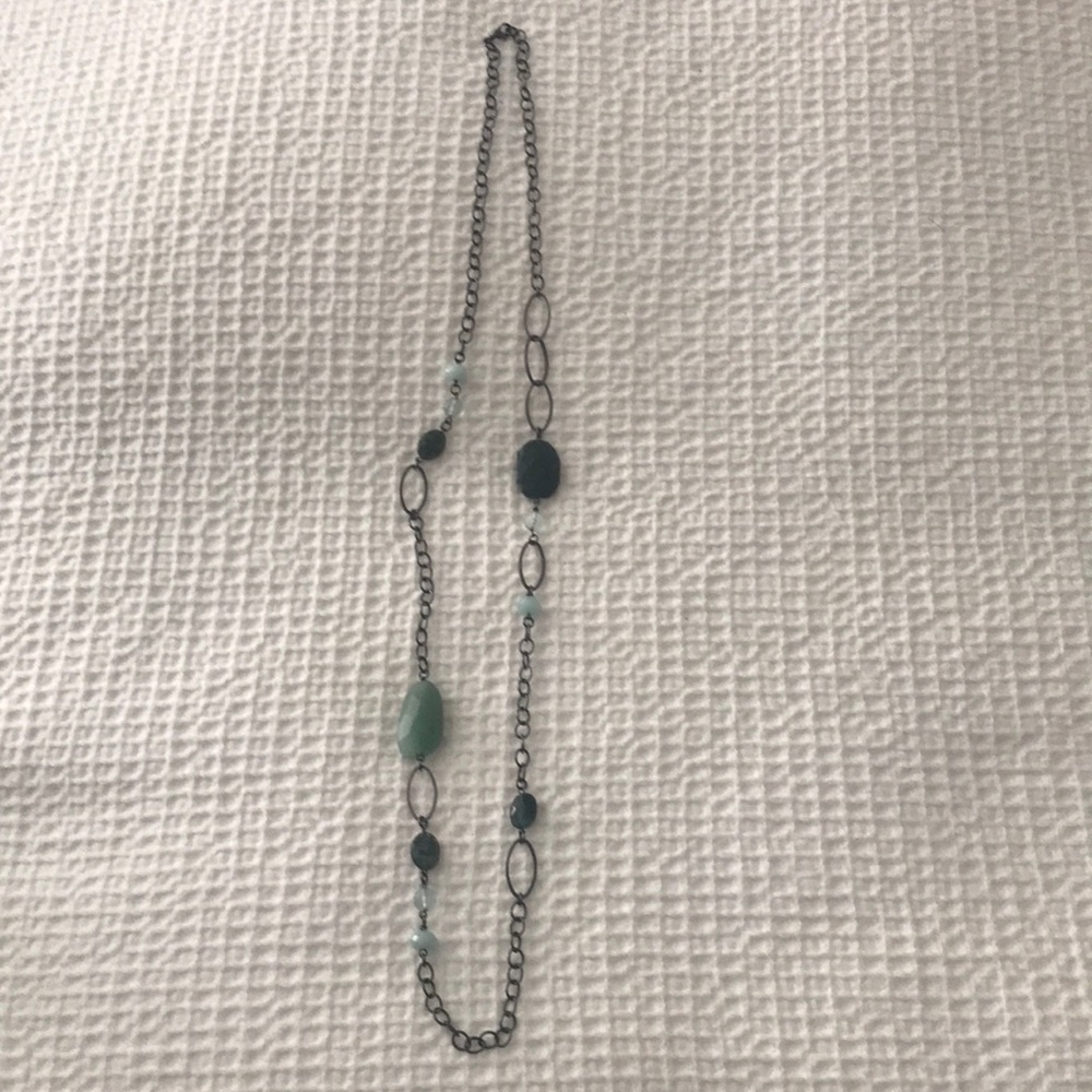 Long chain link necklace with green stones